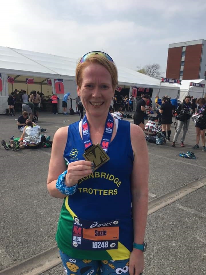 suzie mills also looking pleased with her manchester marathon medal.jpg