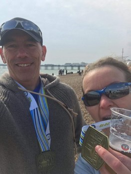 leah and colin harper with their brighton marathon medals.jpeg