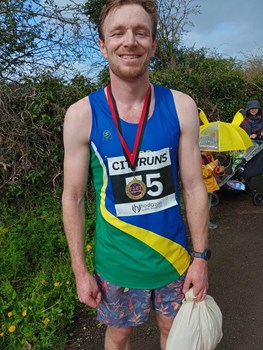 proud trotter diplaying his medal.jpg