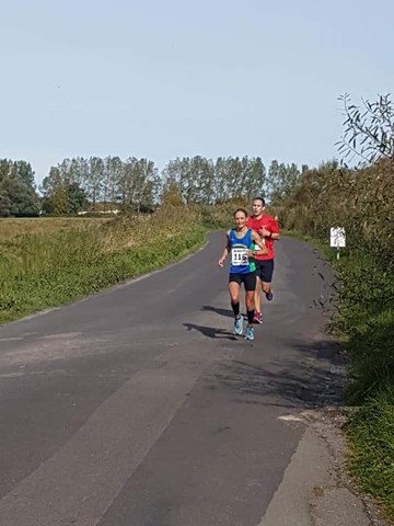 helen on her way to new fv40 half marathon club record.jpg