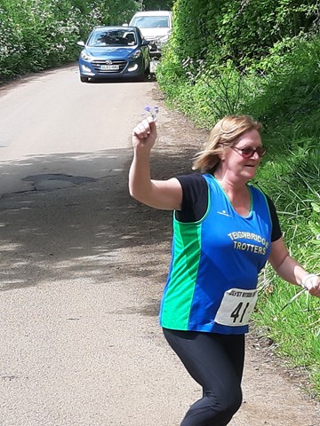 melanie saunders has time to pick some blue bells during hydon huff.jpg