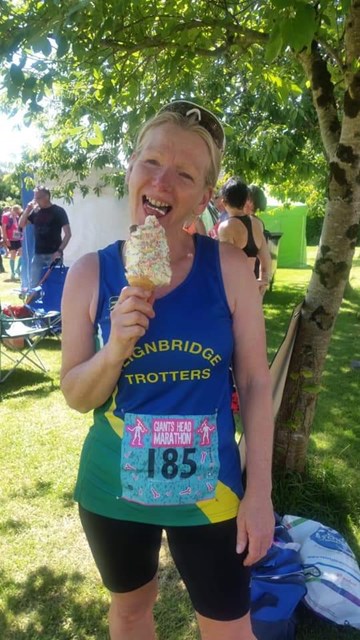 sally enjoying her ice cream after completing the giant head marathon.jpg