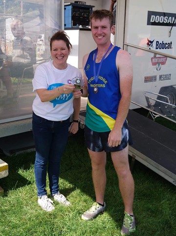 tim pratt collecting his 10k 3rd place award at bridgwater.jpg