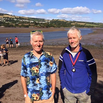 derek and john skinner having received their mud race medals.jpg