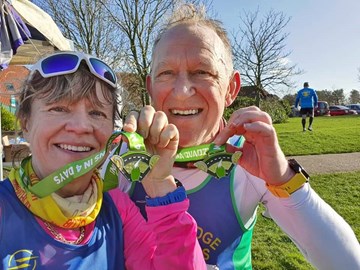 sharon and paul sharples with their quadzilla marathon medals.jpg