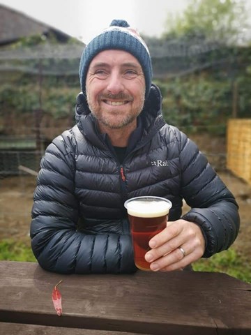 michael mooney enjoying a well deserved beer after competing his first marathon.jpg