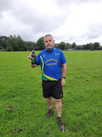 andy distin enjoying a beer after otter rail and river 10k.jpg