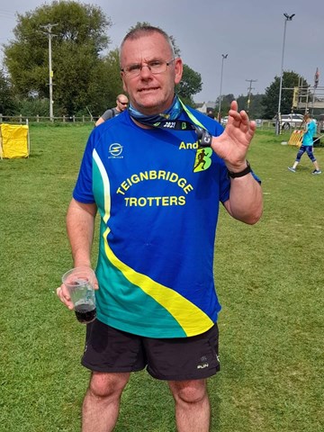 andy distin proudly shows off his plymouth half medal.jpg