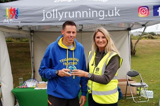 kris receiving his award at the cream tea caper.jpeg