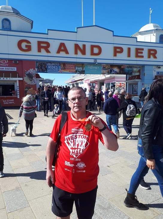 andy distin displays his weston half medal.jpg