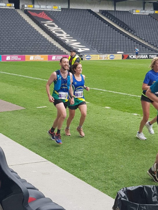 natalie and joe finishing the milton keynes marathon.jpeg