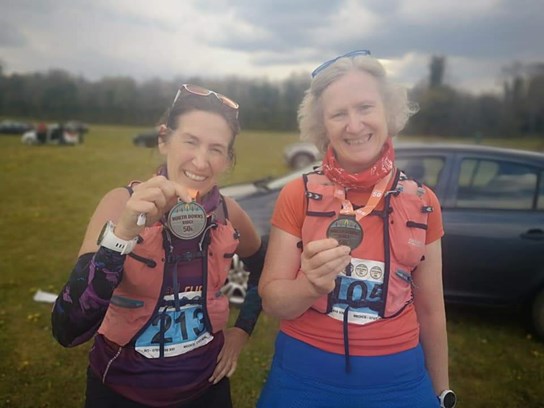 kim and ruth with their hard earnt north downs ridge 50k ultra medals.jpg