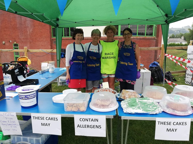 lucy payne and her team behind the cake stall.jpeg