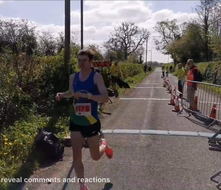 jamie barnett crossing the line at cheshire elite marathon.jpg